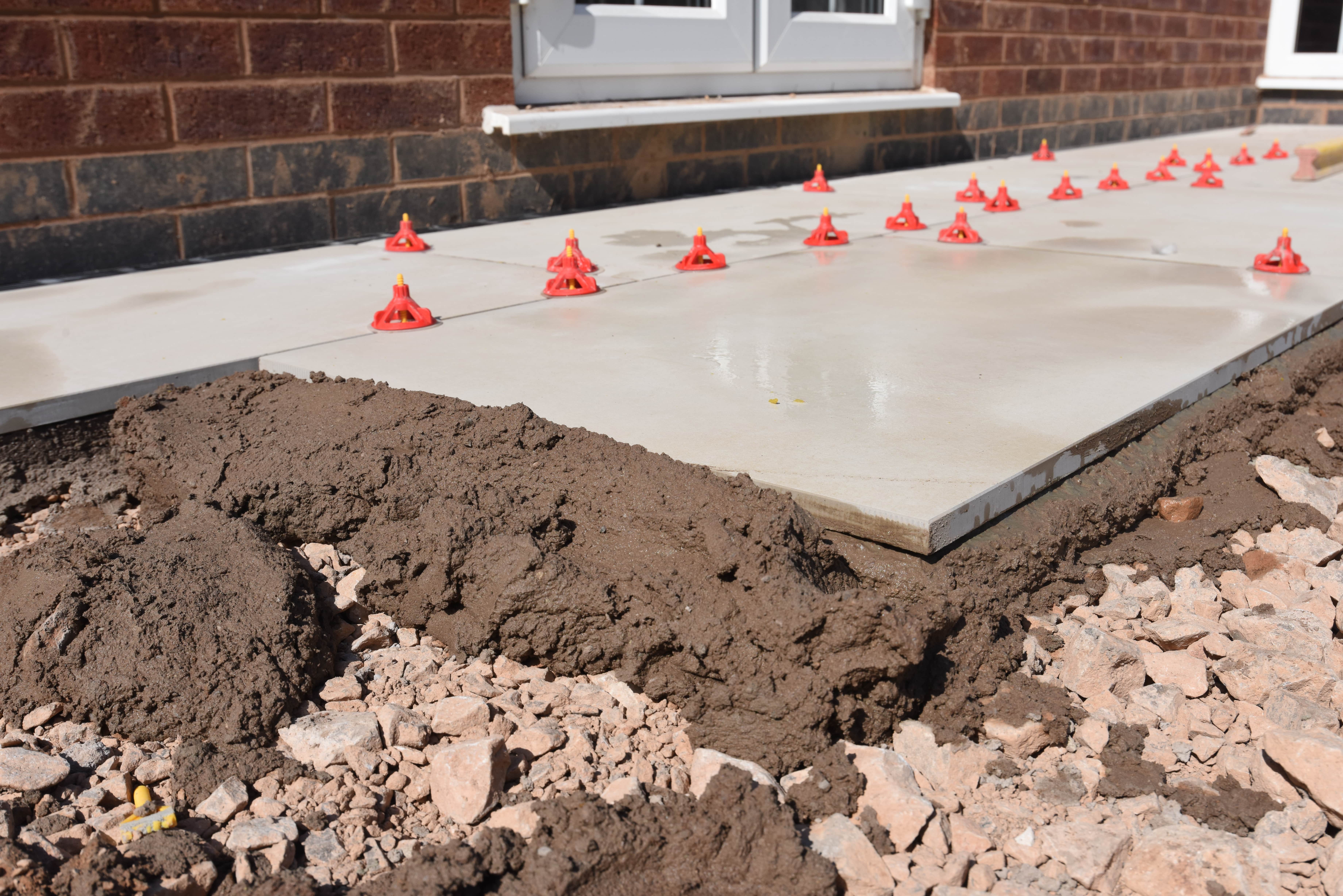 Porcelain Slabs laid on to a mortar bed in a uniform fashion